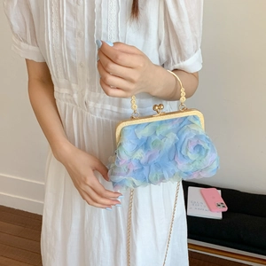 Elegant chiffon floral clutch bag in light blue with gold frame and chain strap