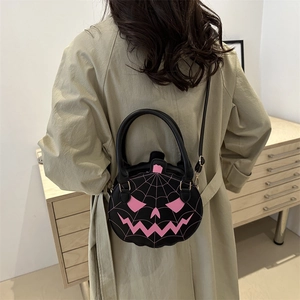 Halloween pumpkin crossbody bag in black leather with pink spooky face embroidery