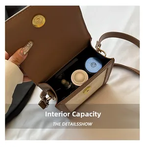Detail view of the brown leather crossbody bag interior showing spacious cosmetic storage