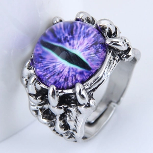 Macro shot of a purple dragon eye ring with silver gothic claw setting details