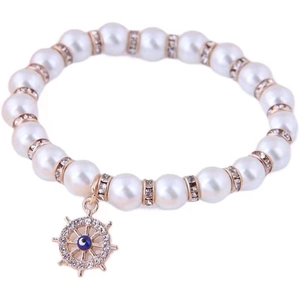 Elegant beaded pearl bracelet with rose gold helm charm and blue evil eye detail