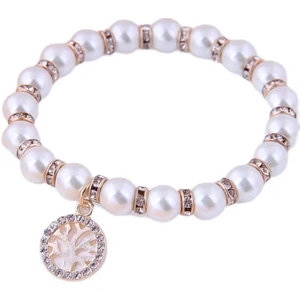 Elegant pearl bracelet featuring gold metal beads and tree of life charm with crystal inlay
