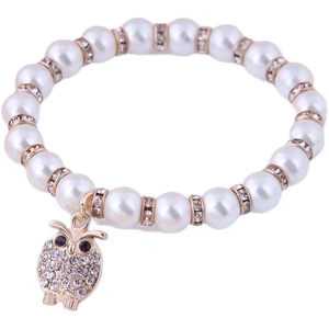 Fashion pearl bracelet featuring a sparkling crystal-encrusted owl pendant in gold finish
