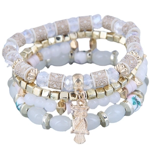 Multilayer beaded bracelet set with gold owl pendant and floral accent beads