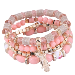 Bohemian multi-layer beaded bracelet set with pink beads and a golden owl pendant