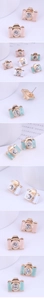 Detailed macro view of colorful enamel camera stud earrings with sparkling center crystals