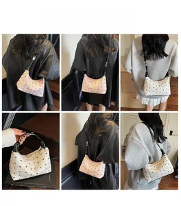 Quilted hobo bag featuring black butterfly prints shown from multiple style angles