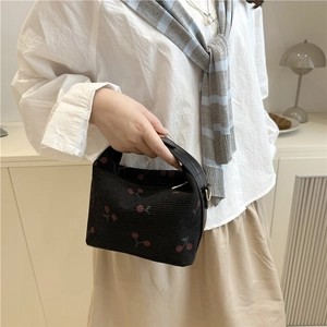 Minimalist black corduroy handbag with red cherry embroidery and leather strap