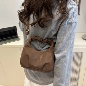 Dark coffee ruched dumpling bag with marble texture finish and stylish pleated handle