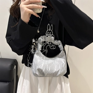 Silver pleated crescent bag with scrunchie handle and detachable strap for women