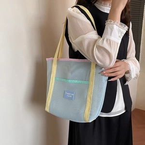 Colorful mesh tote bag for beach and travel with comfortable yellow top handles