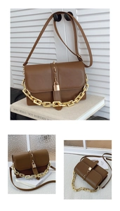 Detail of vintage brown crossbody bag with gold chain and magnetic buckle closure