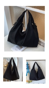 Detail view of black canvas tote bag showing drawstring sides and large storage capacity