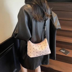 Pink bow-patterned shoulder bag with bubble texture and black strap for women