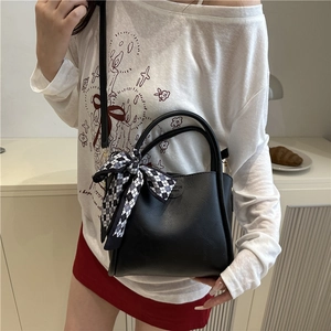 Minimalist black PU leather crossbody bag with checkered silk scarf and round logo detail