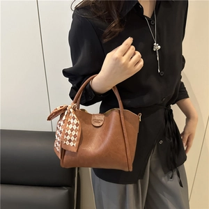 Brown PU leather trapezoid handbag with a decorative plaid silk scarf on the handle
