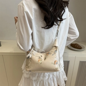 Embroidered cream hobo shoulder bag with floral and bird motifs for women