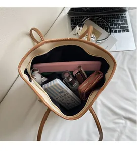 Interior view of the large tote bag showing ample space for a tablet, wallet and cosmetics
