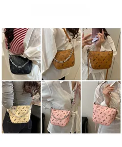 Multiple views showing cartoon print bucket bags in black, brown, cream, and pink colors