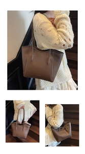 Detail view of brown PU leather tote bag featuring gold lettering and long shoulder straps