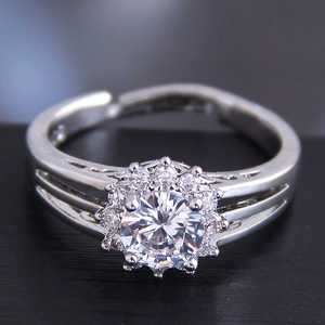 Detailed macro view of a floral cluster cubic zirconia ring with an open adjustable band