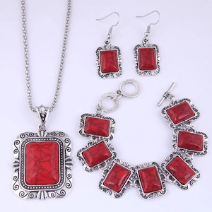 Parure de bijoux bohème argentée avec pierres turquoise rouges et gravures florales