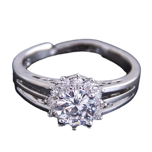 Elegant silver open ring featuring a floral cubic zirconia cluster and adjustable band