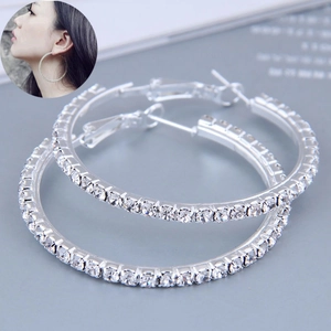 Macro shot of large 60mm silver hoop earrings with pavé set cubic zirconia crystals