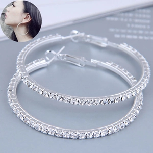 Detail of 60mm silver hoop earrings with micro-paved crystal rhinestones and push-back closure
