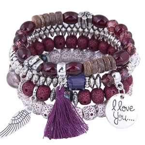 Bohemian multilayer beaded bracelet with purple tassels and metal feather charm