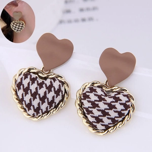 Elegant heart-shaped drop earrings with red houndstooth fabric and golden metal borders