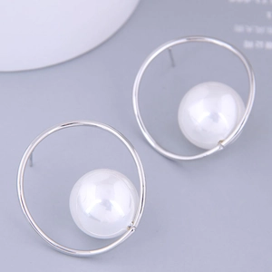 Minimalist silver geometric hoop earrings with large lustrous white pearl accents