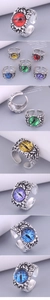 Detail of vintage adjustable evil eye rings with colorful stones and rustic texture