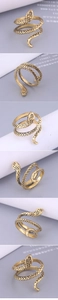 Macro detail of vintage gold snake ring showing intricate scale textures and wrap design