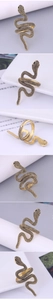 Macro shot of retro gold snake ring showing detailed scales and vintage texture