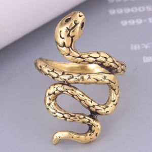 Close-up of vintage gold snake ring showing detailed scales and textured serpent body