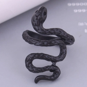 Macro shot of matte black snake ring featuring intricate scale textures and spiral wrap design
