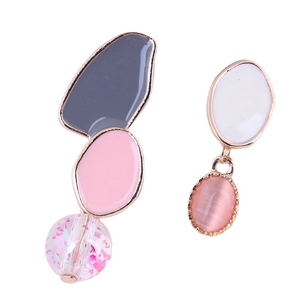 Asymmetric floral vine earrings with pink cat eye stone and geometric resin in gold finish