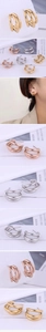 Detailed view of triple hoop C-shape earrings in gold, silver and rose gold finishes