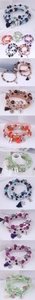 Close-up of three-layer candy bead bracelets with metal clovers, tassels and Love charms
