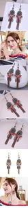 Detail of bohemian leaf tassel earrings with turquoise beads and antique bronze finish
