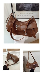 Detailed view of brown retro underarm bag with multi-pockets and silver hardware