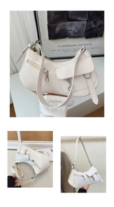 Detail of off-white hobo bag with zip pocket, crescent shape and metal hook buckle