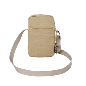 Minimalist beige nylon crossbody phone bag with adjustable strap for women in summer