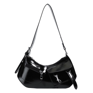 Chic black patent leather crescent shoulder bag with pockets and silver hardware detail