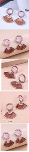 Detail view of geometric drop earring with purple metal ring and marbled resin fan charm