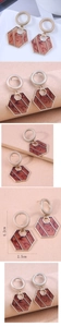 Detail view of marble pattern hexagonal drop earrings with dimensions 4.2cm by 2.5cm
