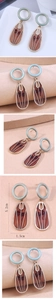 Detail view of retro geometric resin earrings with dimensions of 5.2cm by 1.5cm