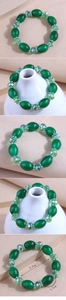 Detail of green beaded bracelet showing 5.5cm inner diameter and 1.5cm resin beads