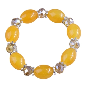 Fashionable beaded bracelet featuring large yellow resin beads and faceted brown crystals